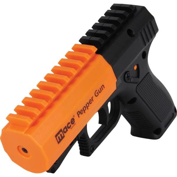 Bright orange Mace pepper gun for self-defense with a black grip and rail design.