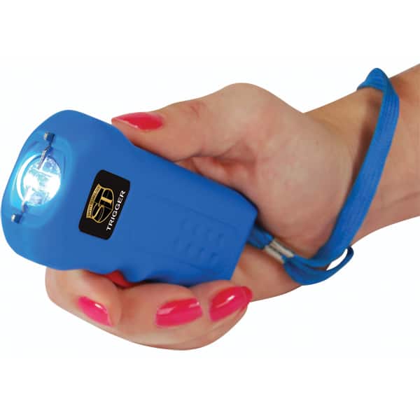 Person holding blue stun gun with a wrist strap, safety device for self-defense.