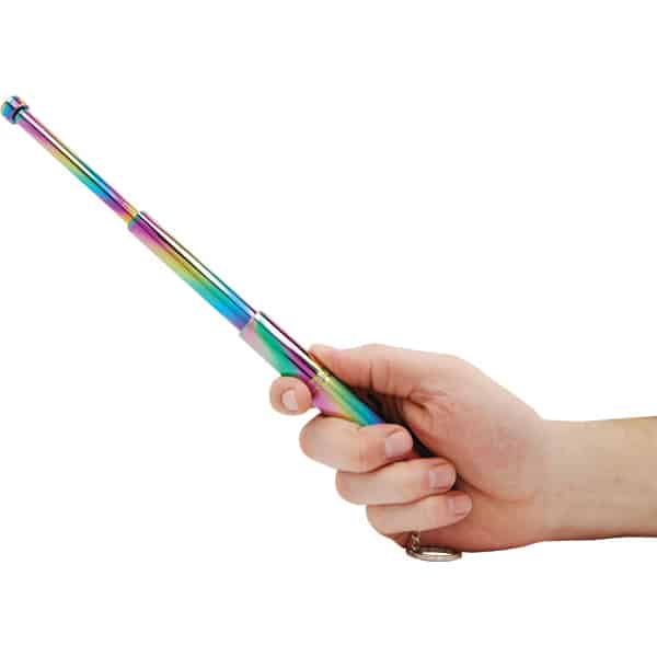 Hand holding a colorful telescopic pointer on a white background.