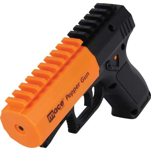 Bright orange Mace pepper spray gun for self-defense, featuring an ergonomic black grip.