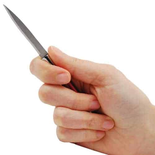 Hand holding a small precision knife with a sharp blade, ideal for crafting or detailed cutting tasks.