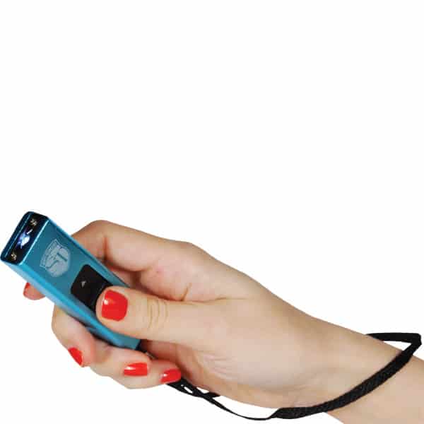 Hand holding blue flashlight with wrist strap, red nails, on white background.