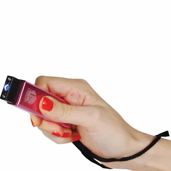 Hand holding a pink stun gun with a safety strap, showcasing a self-defense tool for personal security.