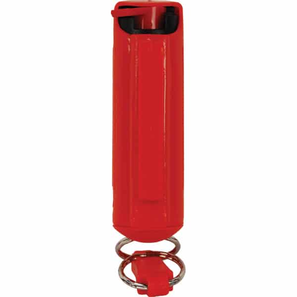 Red pepper spray canister with keyring for personal safety and self-defense.