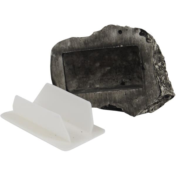 Handmade meteorite business card holder with white plastic insert, ideal for unique desk organization.